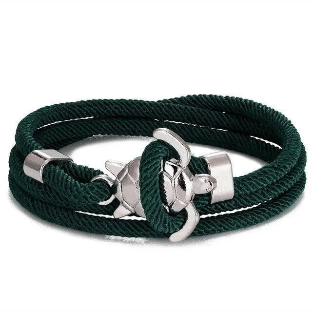 Elegante bracciale da donna intrecciato, corda celeste con charm tartaruga marina, stile boho marino.