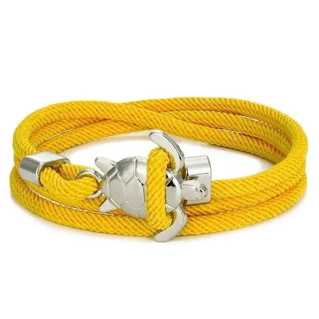 Delicato bracciale da donna intrecciato, ciondolo tartaruga marina. Gioiello ispirato all'oceano.