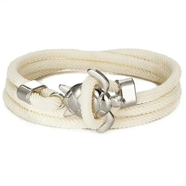 Bracciale intrecciato per donna con charm tartaruga marina. Accessorio spiaggia celeste/turchese.