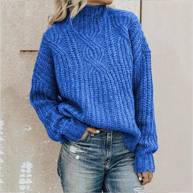 Elegante maglione donna oversize a trecce, con collo alto. Un capo di maglieria invernale per un look rilassato e chic.
