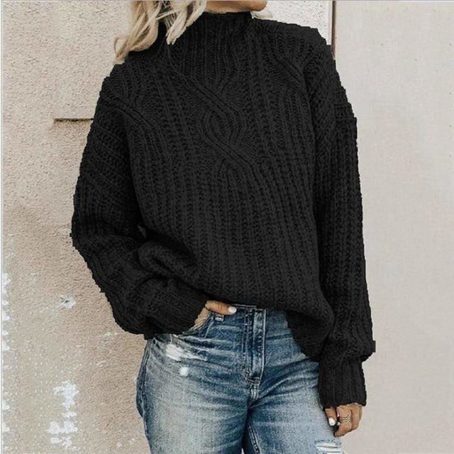 Maglione donna autunnale/invernale oversize con elaborata lavorazione a trecce e collo alto, per comfort e stile.