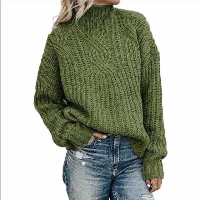 Maglione donna in maglieria calda, modello oversize con collo alto e lavorazione a trecce. Perfetto per moda e comfort.