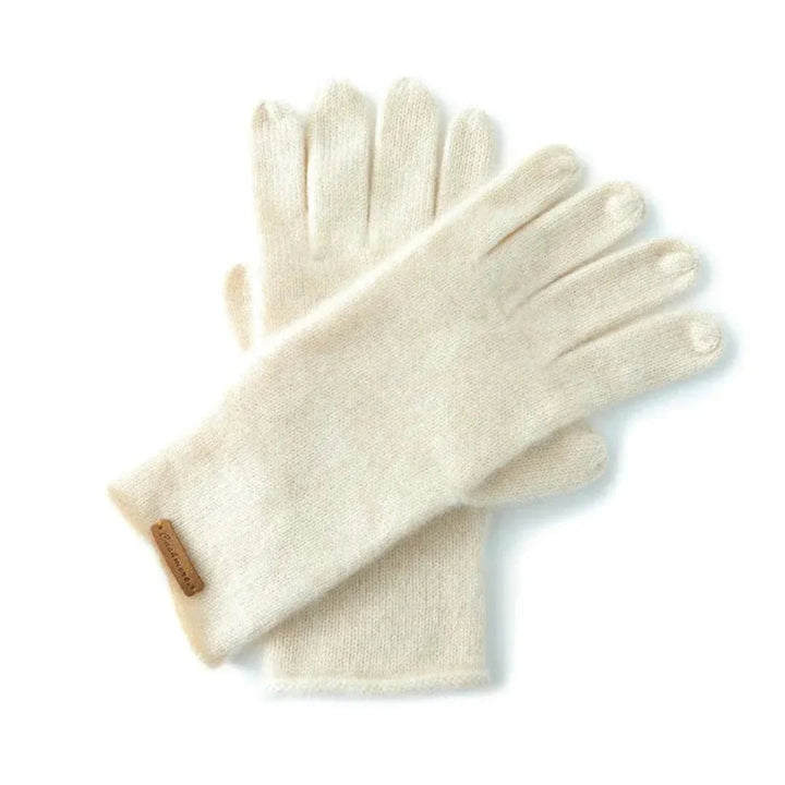Guanti eleganti da donna con polsini estesi, perfetti per l'inverno. Accessorio moda raffinato e caldo.