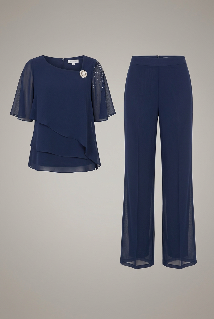 Completo pantalone donna elegante per cerimonia con top stratificato e dettagli luminosi, perfetto per look sera.