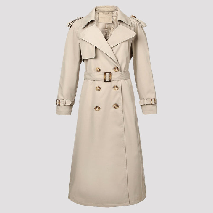 Trench donna lungo doppiopetto con cintura, versatile e chic. Un capospalla essenziale per la moda autunnale e primaverile.