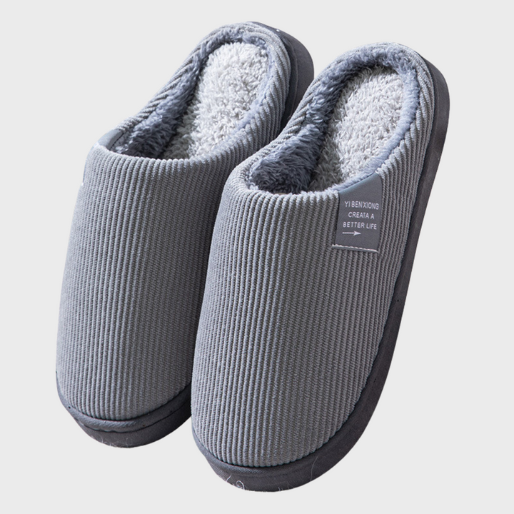 Pantofole slip-on da donna in tessuto morbido, perfette per mantenere i piedi al caldo in tutta la casa.