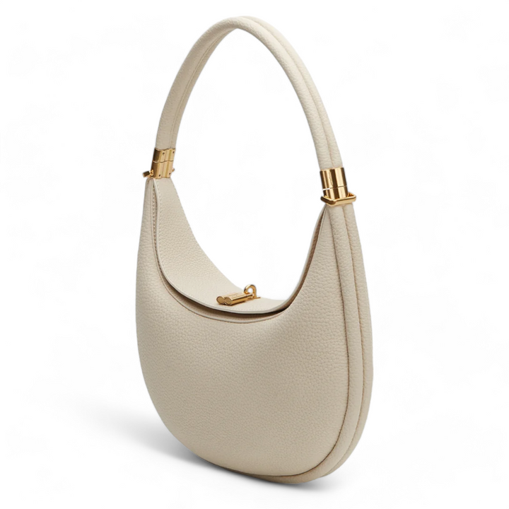 Elegante borsa a spalla donna in vera pelle martellata con chiusura girevole. Accessorio moda indispensabile.