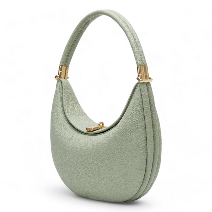 Borsa da donna chic in pelle martellata con design a mezzaluna e chiusura girevole. Eleganza e funzionalità.
