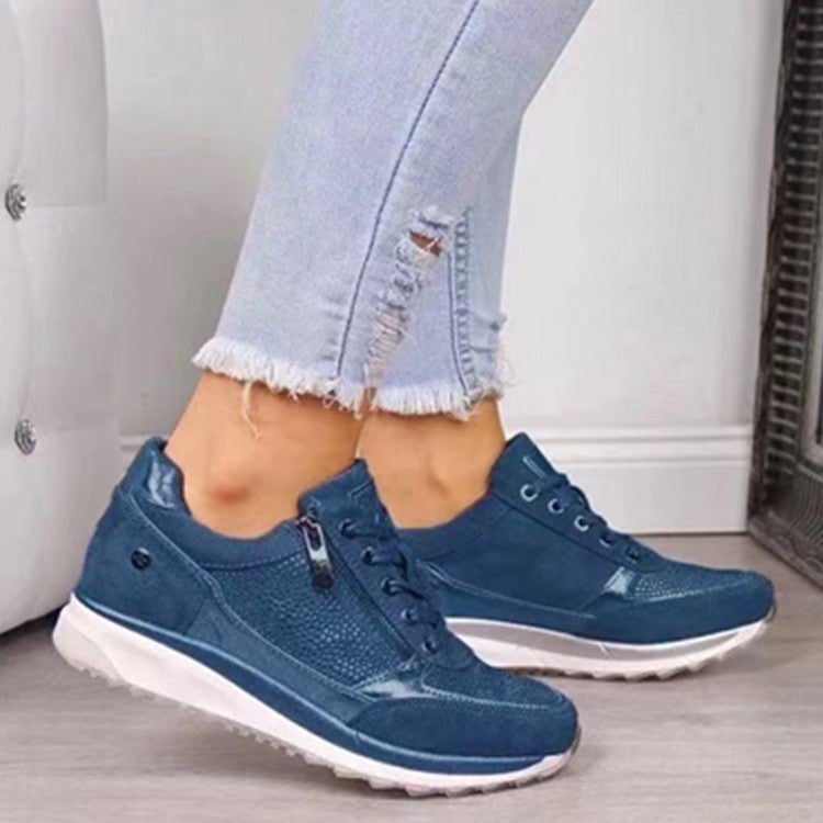 Sneakers platform donna con cerniera laterale e dettagli metallici. Perfette per uno stile urbano trendy.