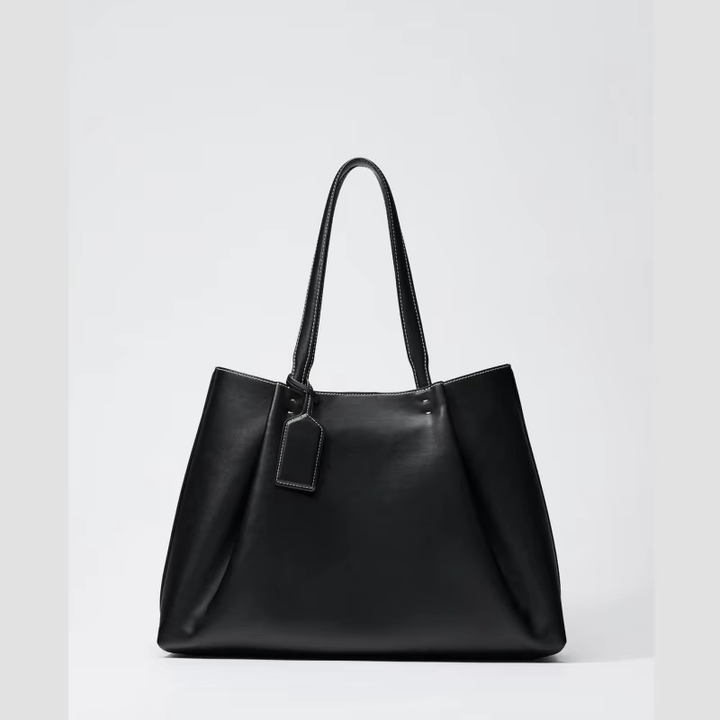 Borsa tote donna in ecopelle con tracolla e cuciture a contrasto, accessorio elegante e versatile per ogni outfit.