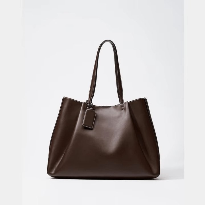 Elegante borsa tote da donna in ecopelle, con tracolla regolabile e cuciture decorative per un look di moda.