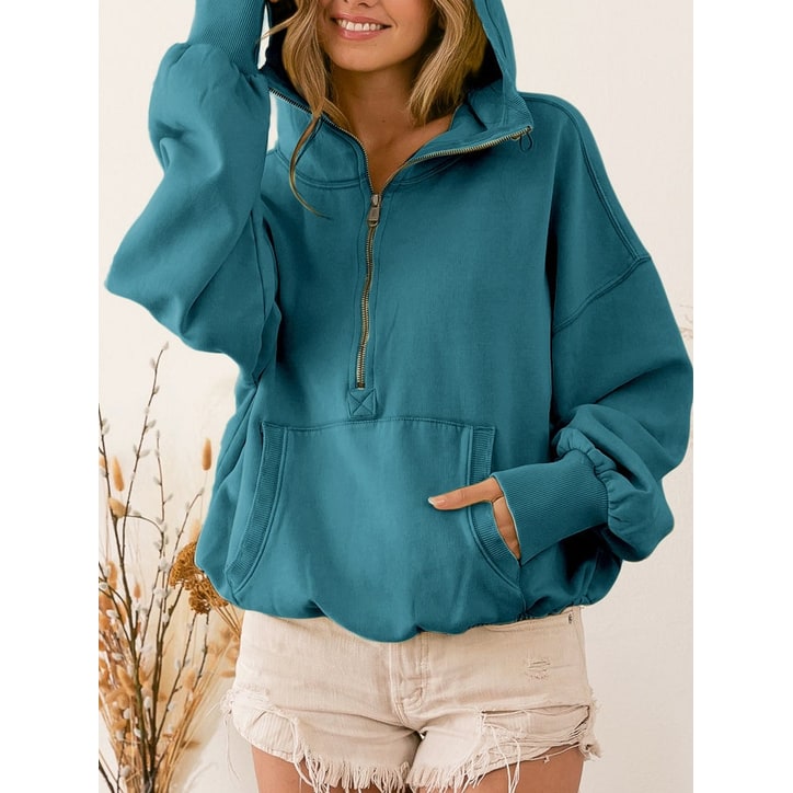 Comoda felpa donna oversize con cappuccio, mezza zip e pratica tasca a canguro per relax quotidiano.