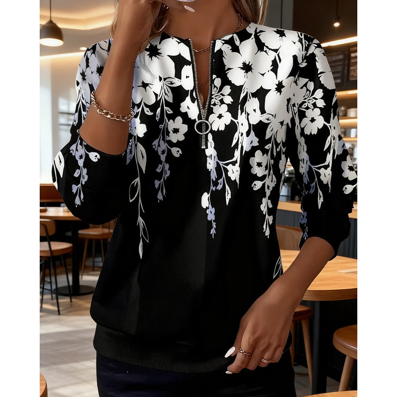 Felpa da donna casual con mezza zip e vibrante stampa floreale botanica, ideale per primavera e autunno.