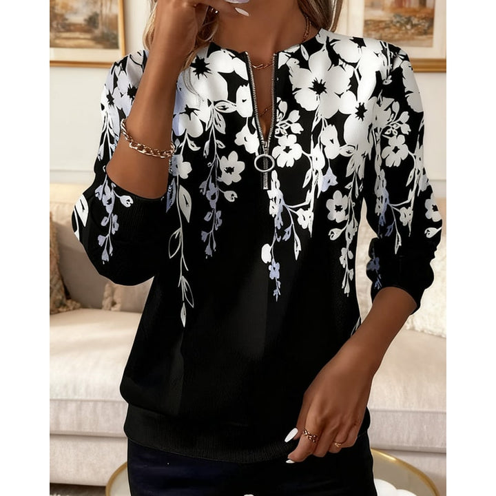 Felpa donna girocollo con mezza zip ed elegante stampa botanica floreale, un capo must-have per la moda casual.
