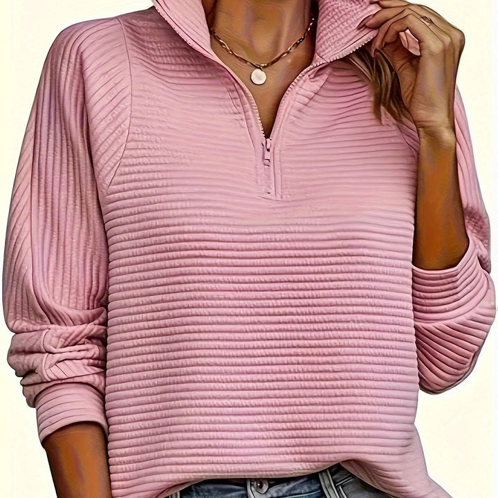 Felpa donna sportiva, mezzo zip, collo alto testurizzato. Comfort e praticità.