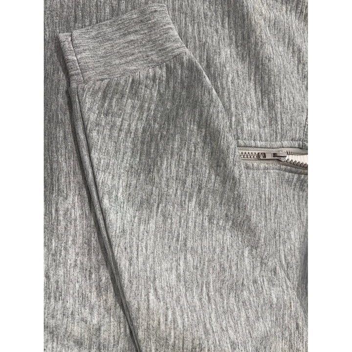 Abbigliamento donna: felpa a mezzo zip con collo alto, lavorazione testurizzata. Stile e comfort.