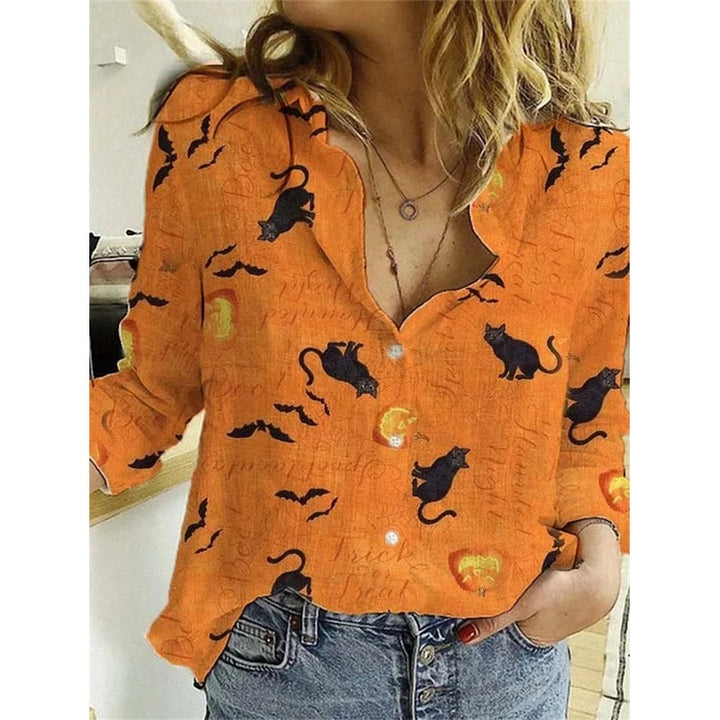 Camicetta donna Halloween con stampa festiva di streghe, zucche e pipistrelli. Perfetta per autunno e feste.