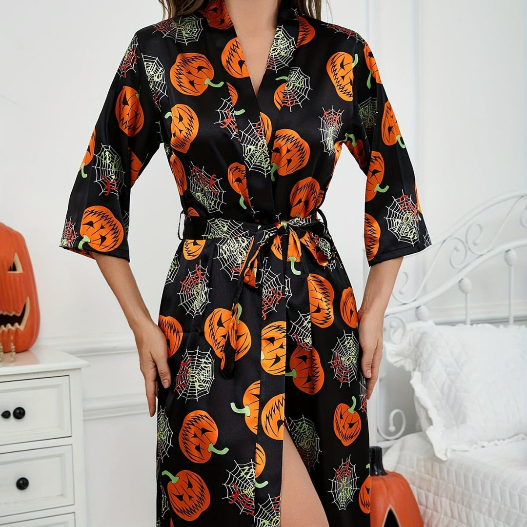 Moderna vestaglia kimono donna autunnale, ideale per Halloween. Design zucca e ragnatela per comfort e stile.