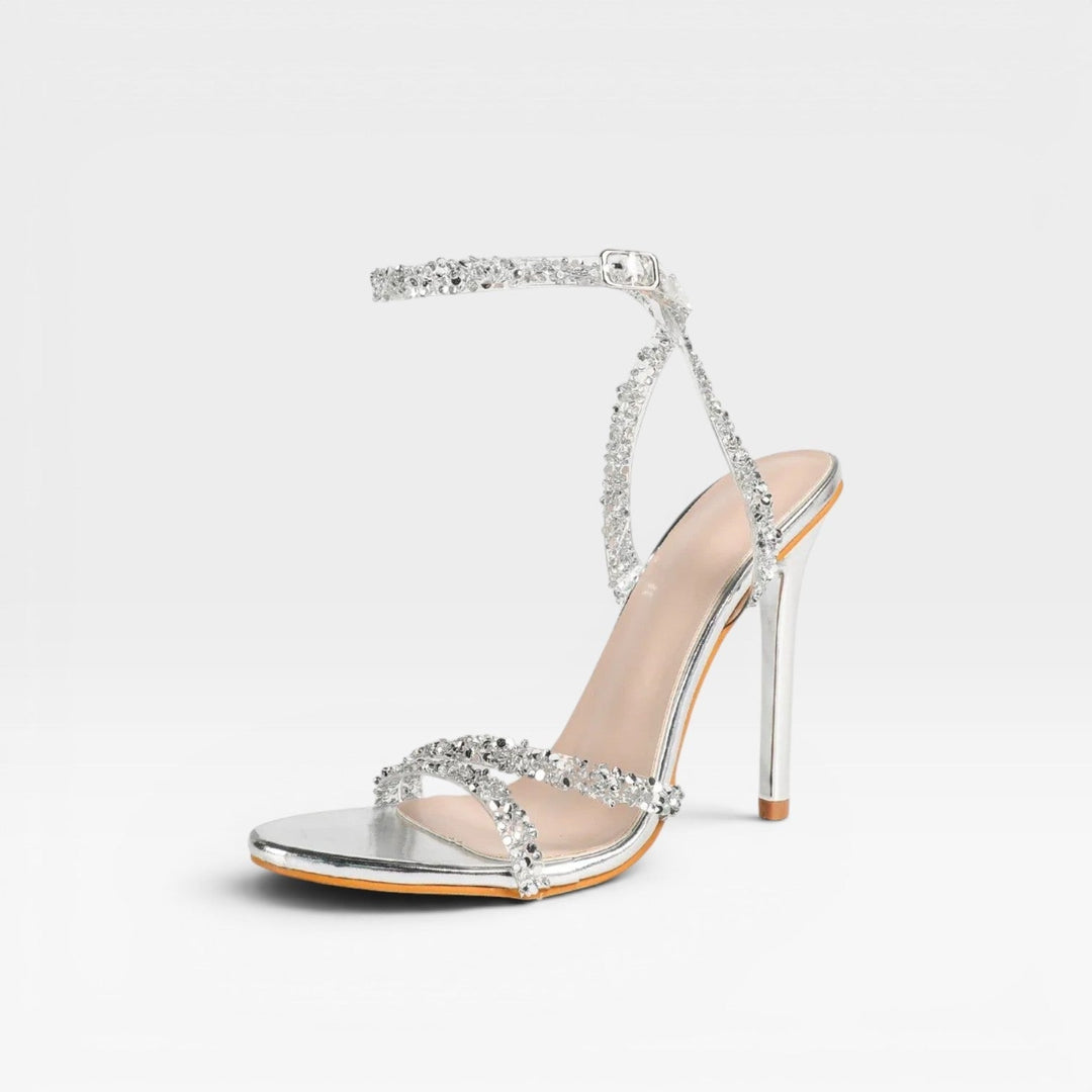 Sandali eleganti da donna con tacco a stiletto e strass, perfetti per eventi e serate speciali.