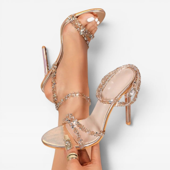 Sandali con tacco alto donna, strass luminosi, punta aperta. Visuale laterale. Perfetti per outfit da sera.