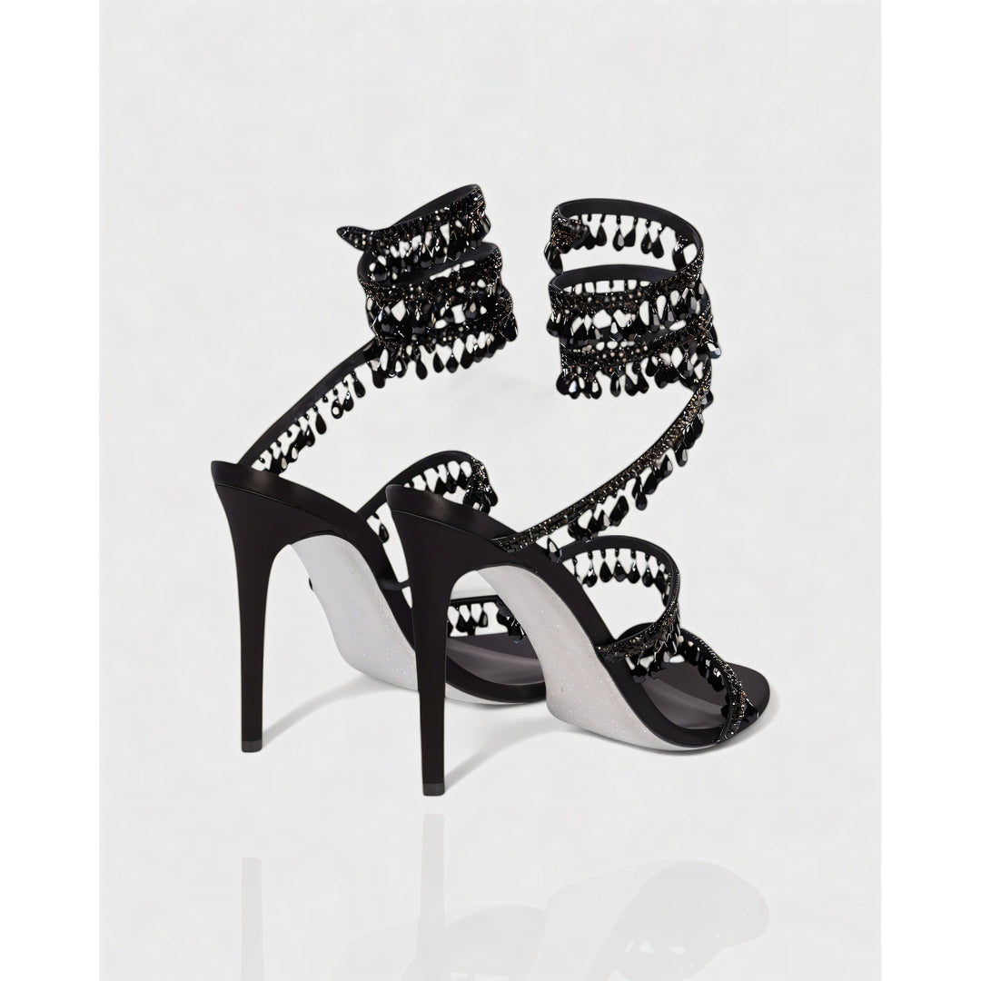 Stiletto brillanti donna con nappe decorative e fascetta alla caviglia. Scarpe da sera.