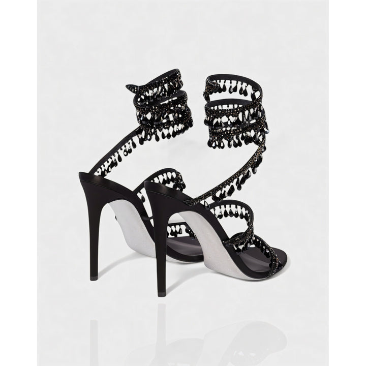 Stiletto brillanti donna con nappe decorative e fascetta alla caviglia. Scarpe da sera.
