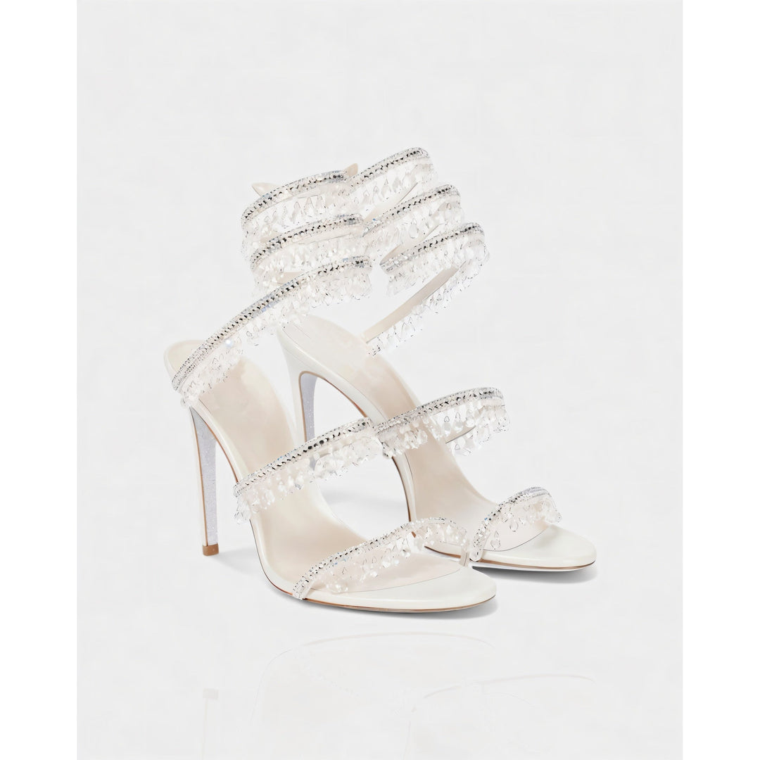 Tacchi alti donna stiletto con fascia alla caviglia e nappe brillanti per un look raffinato.
