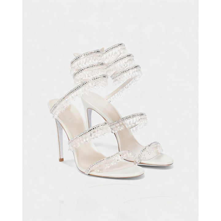 Tacchi alti donna stiletto con fascia alla caviglia e nappe brillanti per un look raffinato.