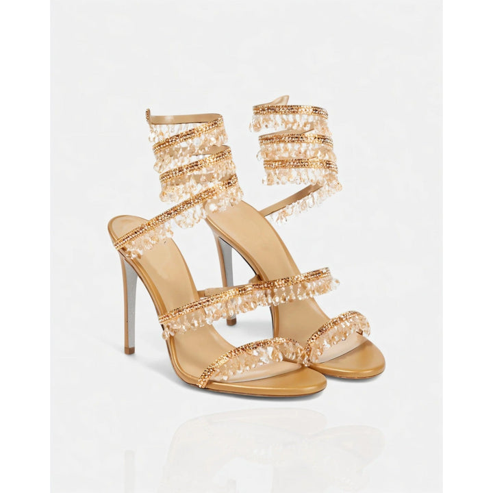 Scarpe eleganti donna stiletto, con fascia alla caviglia e nappe brillanti. Look glamour.