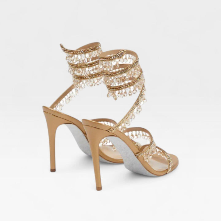 Tacchi alti donna per feste e matrimoni, con cinturino a spirale di cristalli e design elegante.