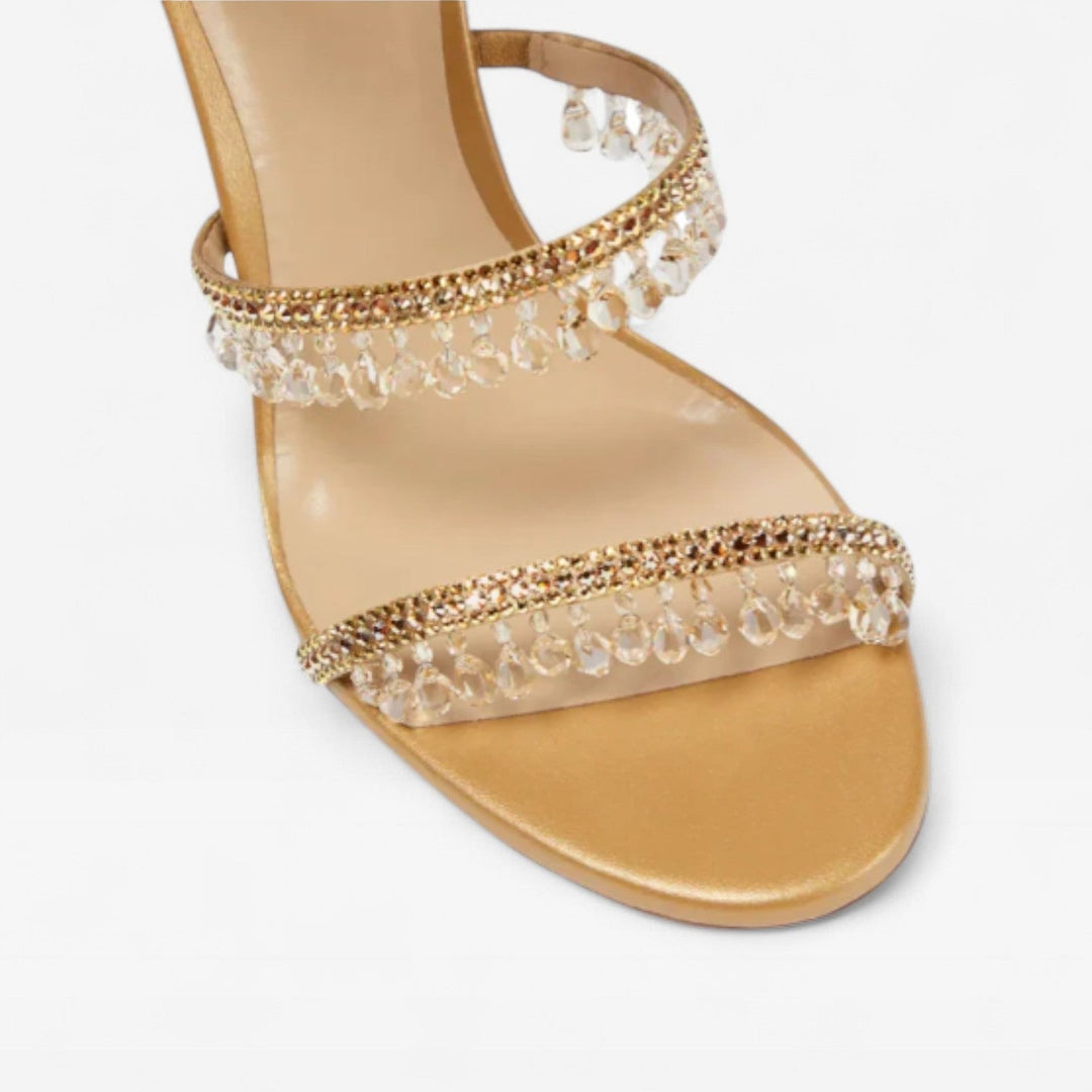 Scarpe da sera donna con tacco alto, cinturino a spirale decorato con cristalli, stile raffinato.
