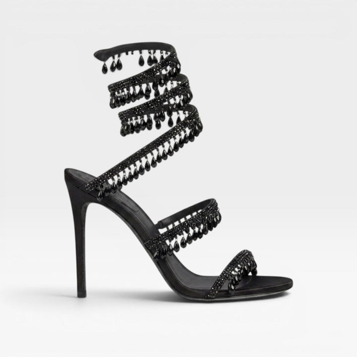 Scarpe eleganti donna con tacco a stiletto e cinturino a spirale tempestato di brillanti cristalli.