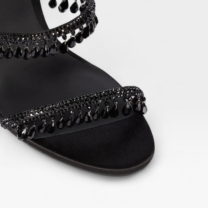 Scarpe da festa donna con tacchi alti, cinturino a spirale di cristalli e design glamour.