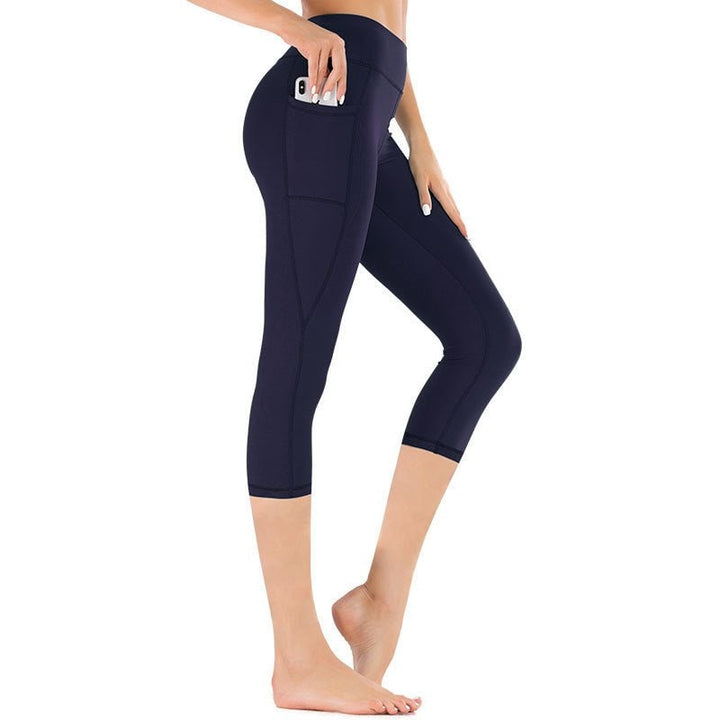 Leggings sportivi capri da donna a vita alta con tasche, ideali per running, comfort e sport.