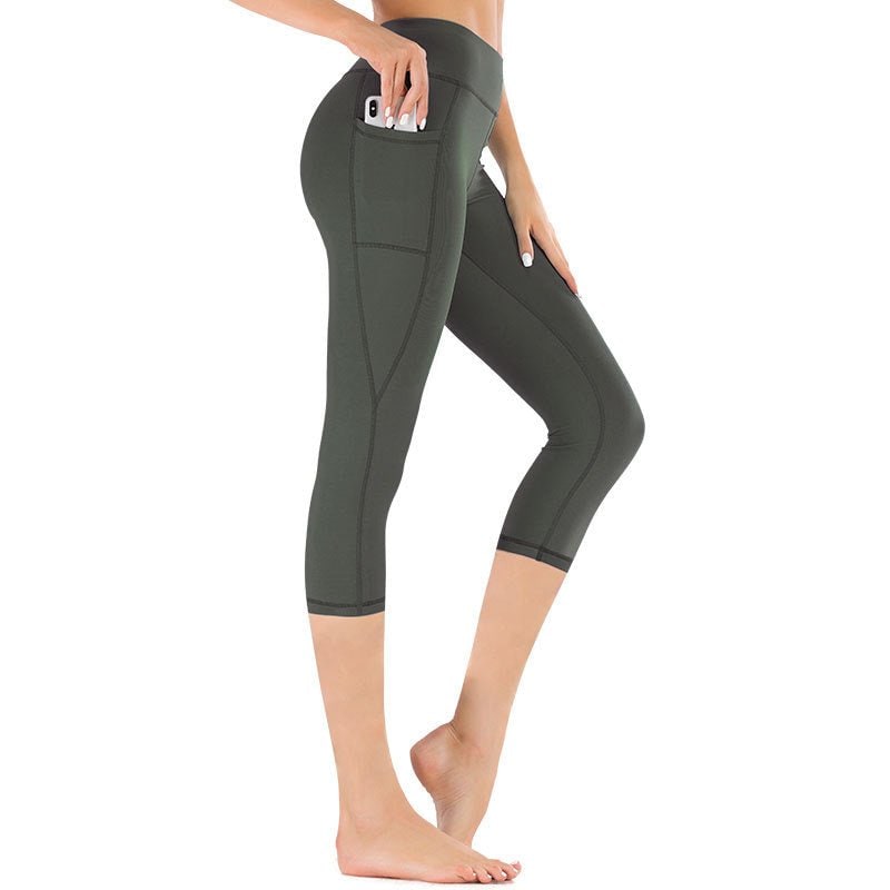 Leggings capri da donna con tasche laterali, a vita alta, per allenamento, sport e comfort attivo.