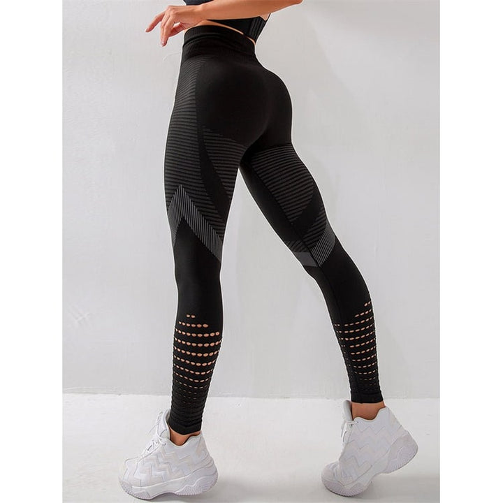 Leggings yoga donna vita alta compressione neri con perforazioni traspiranti per fitness e allenamento.