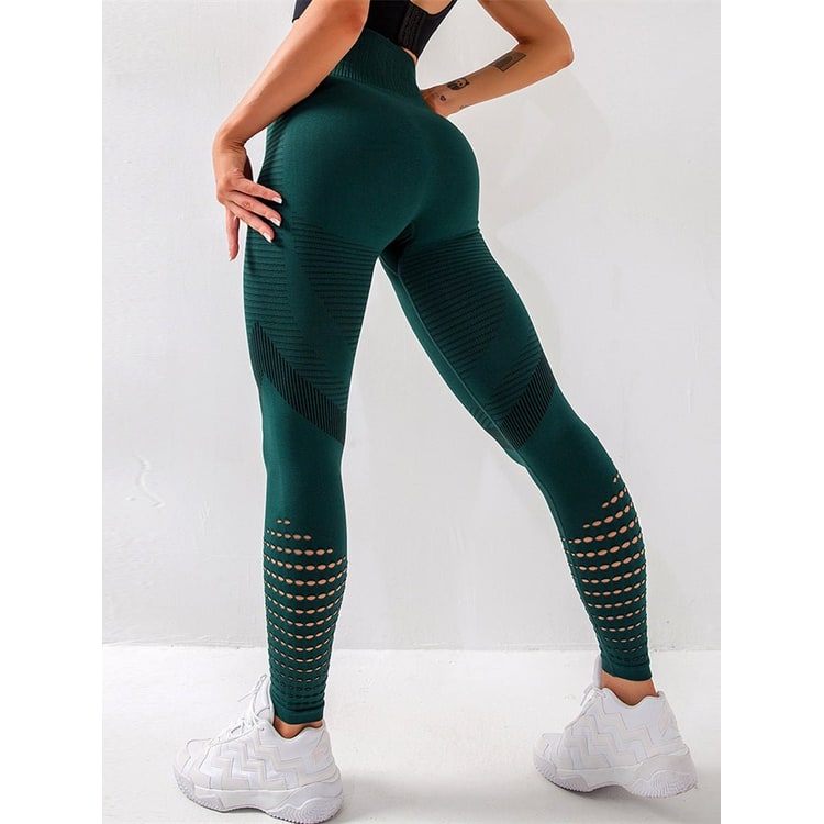 Leggings sportivi donna neri con vita alta, compressione e dettagli perforati. Perfetti per activewear.