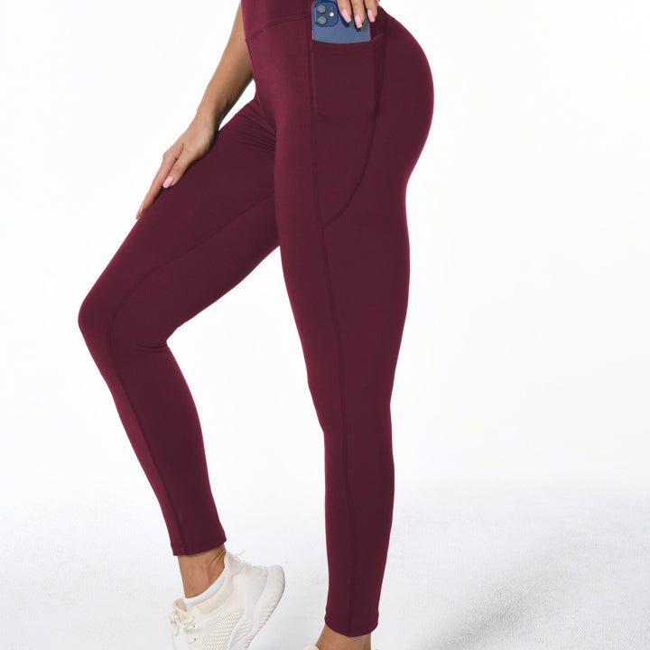 Leggings sportivi da donna con tasche laterali, vita alta modellante per yoga, palestra e attività.