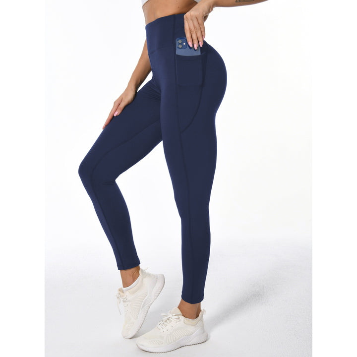Leggings activewear da donna elasticizzati neri con vita alta e tasche laterali, ideali per sport e fitness.
