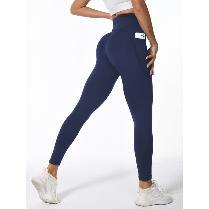 Leggings fitness da donna con tasche per smartphone, vita alta per supporto in allenamento e palestra.
