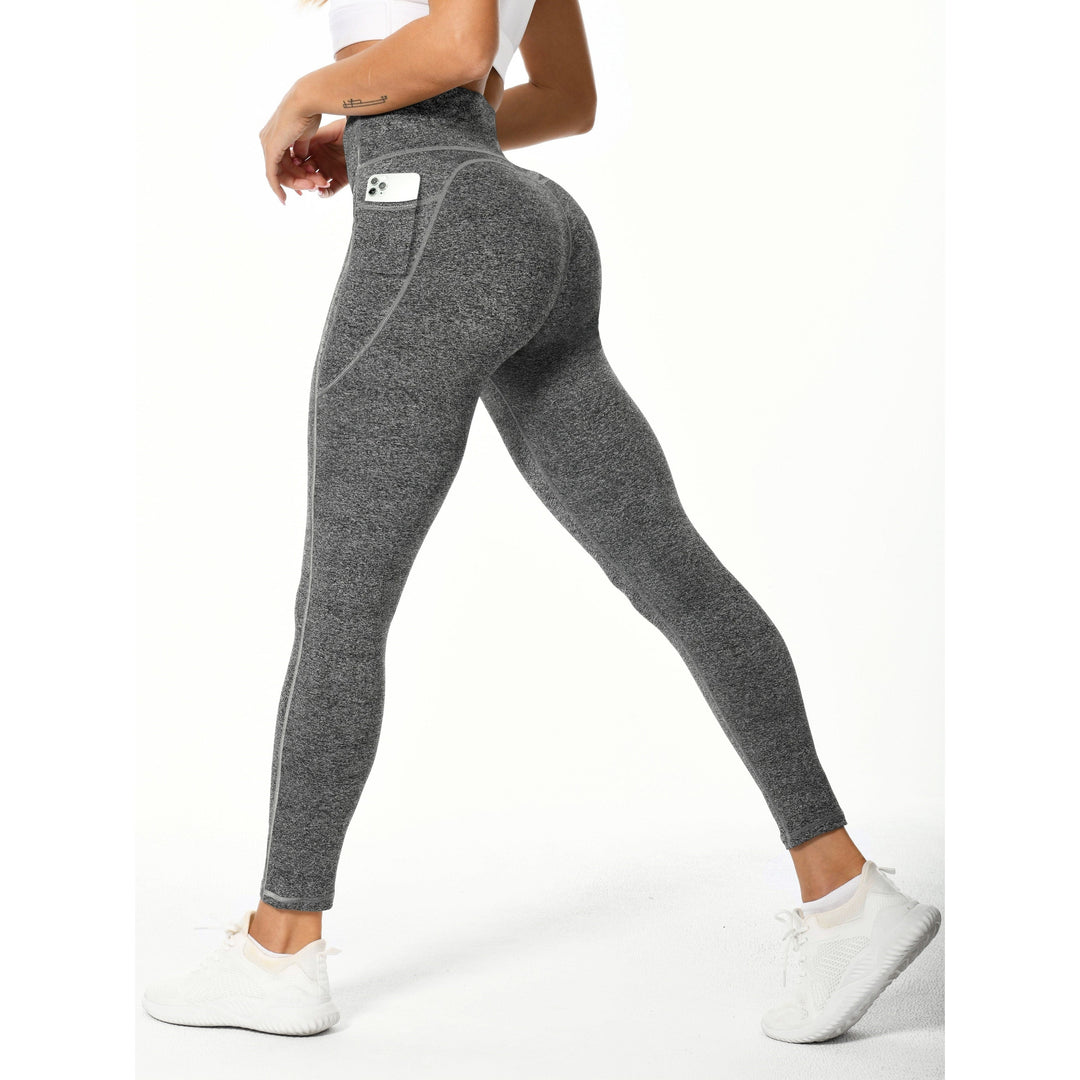 Immagine frontale di leggings da donna neri a vita alta con tasche laterali, perfetti per il tuo allenamento.