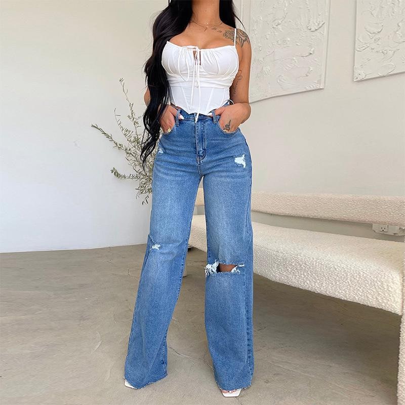 Jeans donna a vita alta con gamba larga, strappi moderni e orlo vivo sfilacciato per un look casual-chic.