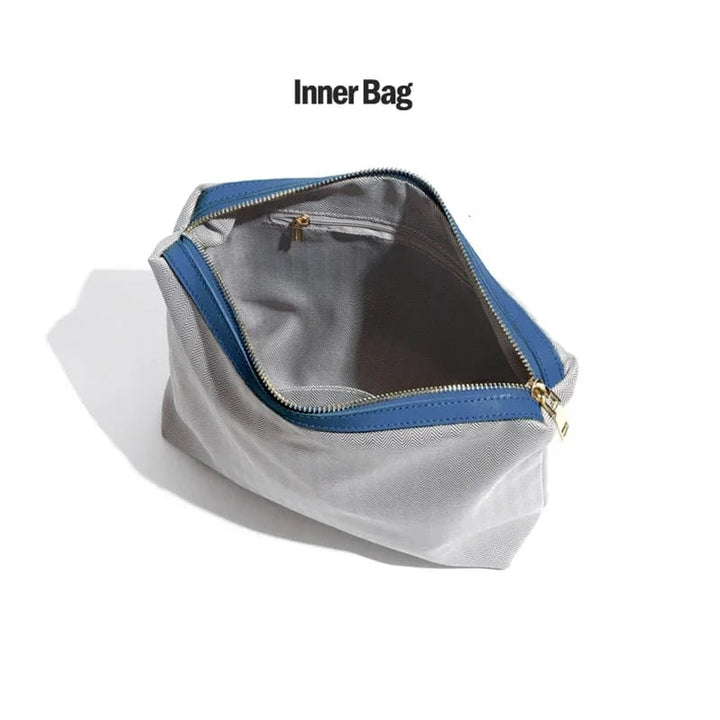 Dettaglio chiusura e cuciture della borsa hobo da donna in pelle, con manico intrecciato per eleganza casual.
