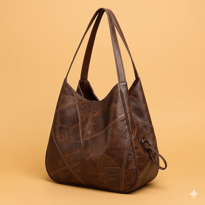 Elegante borsa hobo slouchy in ecopelle per donna, design patchwork geometrico, perfetta per uso quotidiano.