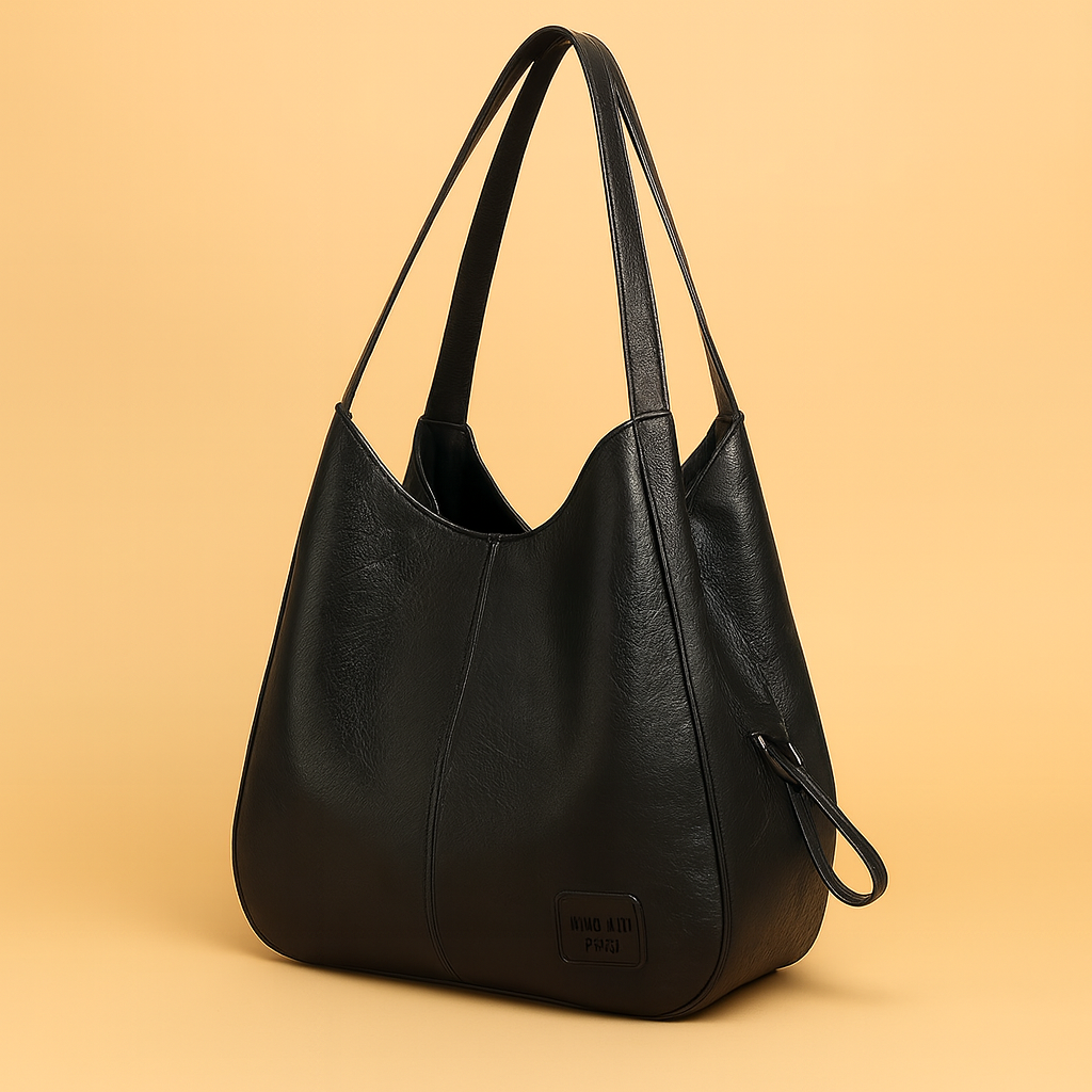 Borsa donna morbida hobo con tracolla, ecopelle e fantasia geometrica patchwork. Accessorio moda casual.