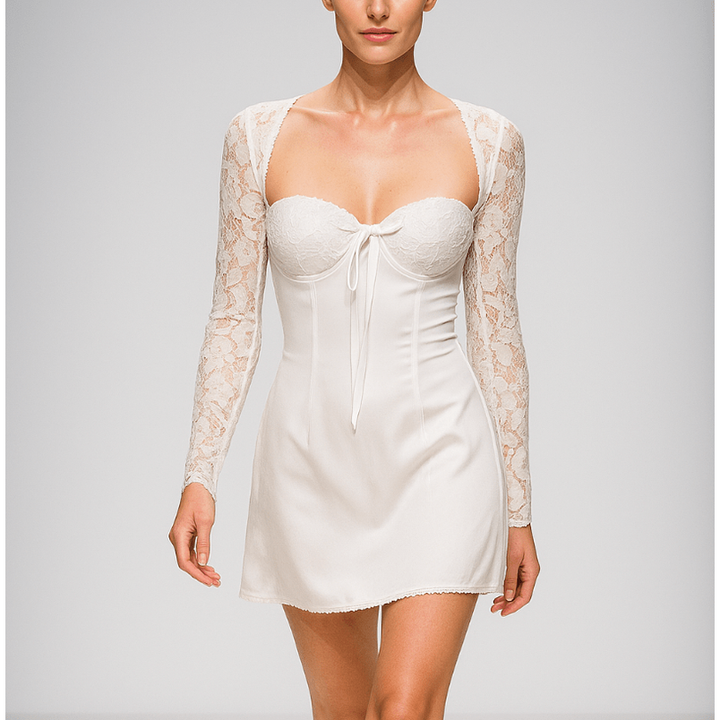 Mini abito con corpetto scollo a cuore, maniche lunghe in pizzo e schiena a corsetto. Ideale per serate eleganti.