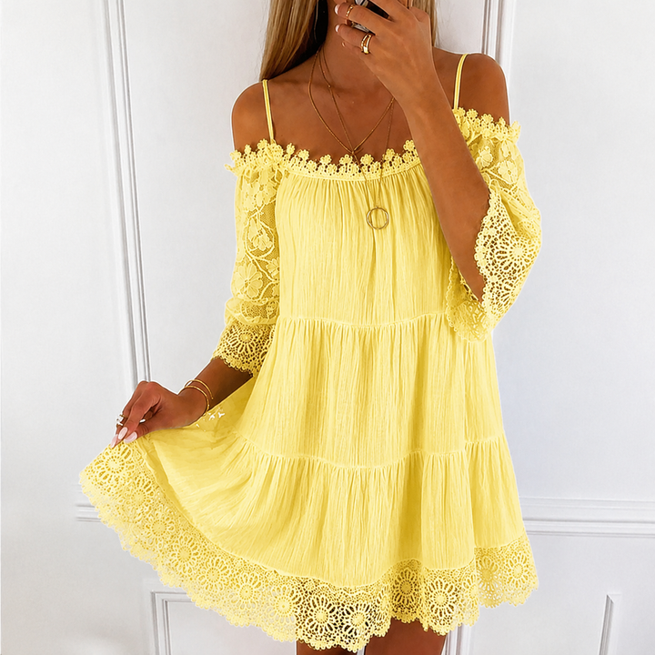 Vestito mini donna pizzo, scollo a barca, maniche a campana. Ideale per cerimonie, party o look estivo elegante.