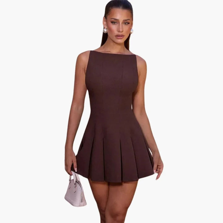 Mini abito plissettato senza schienale per donna, spalline sottili, ideale per feste estive e occasioni speciali.
