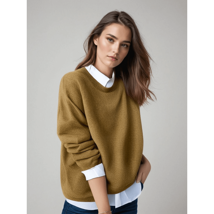 Maglione donna a girocollo oversize con vestibilità rilassata e polsini a costine. Ideale per outfit casual e comodi.