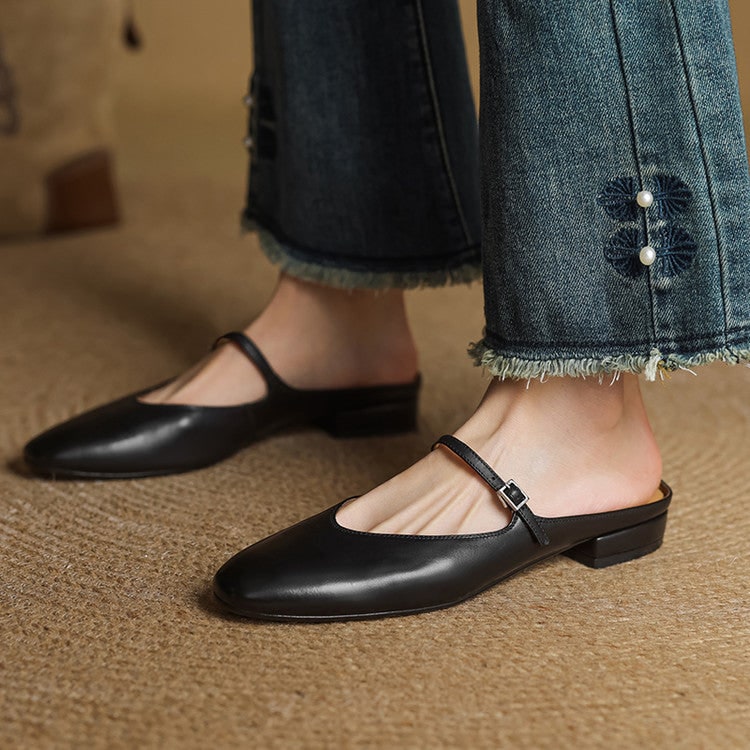 Scarpe da donna Mary Jane, mules basse con cinturino incrociato e punta a mandorla. Stile ricercato.